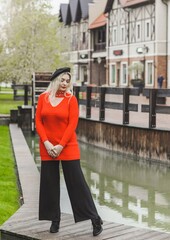 Woman at city, plus size blonde nice woman outdoor portrait. Pretty nice lady in fashionable warm outfit, lifestyle, shopping time, woman at walk