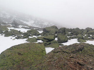 high mountain in fog