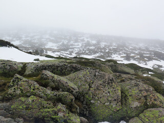 high mountain in fog