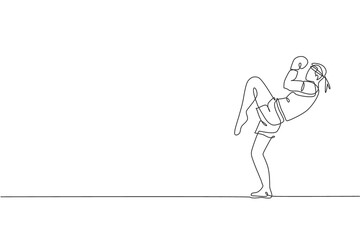 Single continuous line drawing young sportive man training thai boxing at gym club center. Combative muay thai sport concept. Competition event. Trendy one line draw graphic design vector illustration