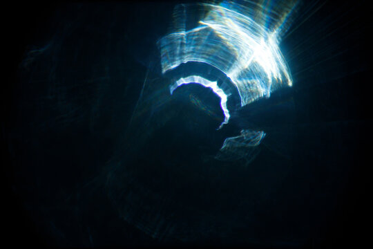 Easy to add lens flare effects for overlay designs or screen blending mode to make high-quality images. Abstract sun burst, digital flare, iridescent glare over black background.