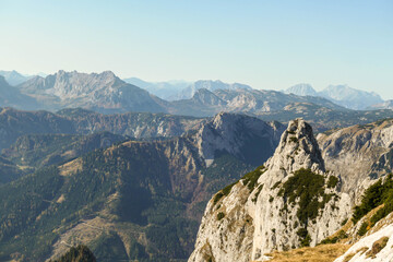 Obraz premium Panoramic view on mountains in Hochschwab region, Austrian Alps. The flora overgrowing slopes is golden. Autumn vibes in the mountains. Remote place, with no people. Freedom and wilderness