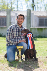breeder posing with his dog