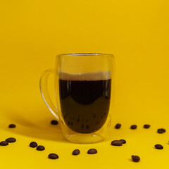 cup of coffee on yellow background