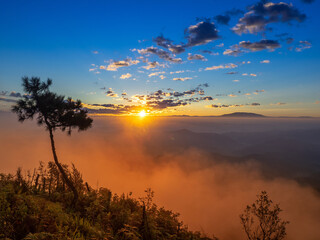 Clouds and sky background,Sunlight flare of sun at sunrise or sunset time with silhouette of mountain