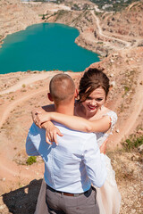 Wedding photosession of young on background a lake in the form of a heart