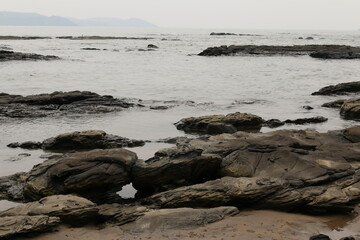 Fototapeta na wymiar waves and rocks on the Arabian sea Goa