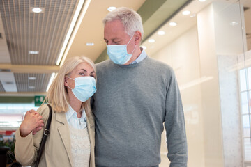 Mature couple shopping during coronavirus pandemic