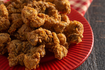 Fried and Crispy Chicken Gizzards on a Dark Wooden Table