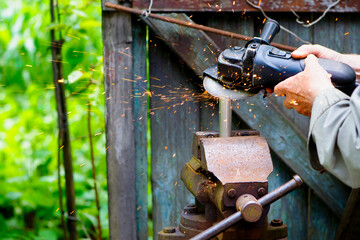 work with metal pipe cutting grinder sparks fly