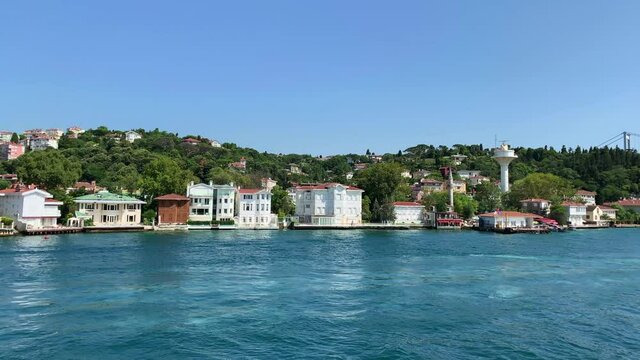 Footage of historical, traditonal mansions in Beykoz / Kanlica area of Istanbul by Bosphorus strait. Beautiful scene. It is a sunny summer day. Camera moves forward.