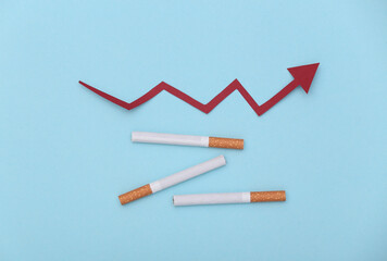 Cigarettes and upward growth arrow on blue background