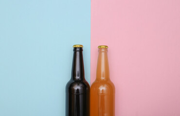 Bottle of light and dark beer on pink blue background. Top view
