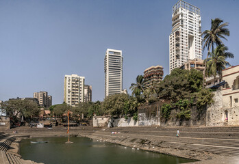 Fototapeta na wymiar Banganga Tank is an ancient water reservoir that is part of the Valkeshwar temple complex at Malabar Hill in Mumbai in India