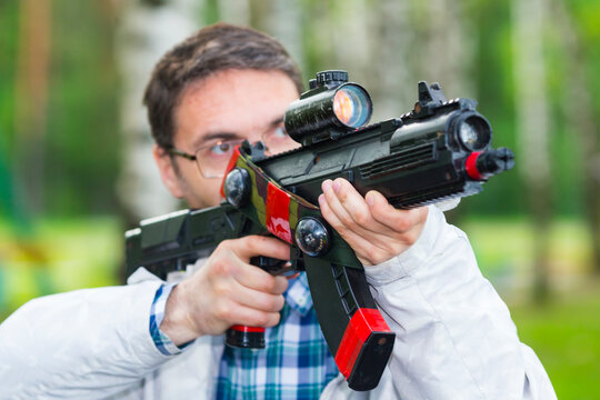 Man aiming the gun laser tag equipment.