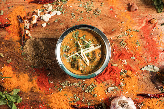 Assortment of various kinds of Indian cousine Indian Food on Wooden rusty table
