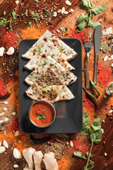 Assortment of various kinds of Indian cousine Indian Food on Wooden rusty table