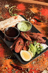Assortment of various kinds of Indian cousine Indian Food on Wooden rusty table