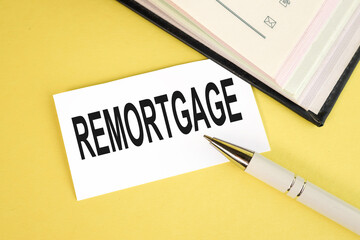 REMORTGAGE, text on white paper on yellow background