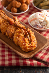 Breaded and Fried Jumbo Shrimp with Tails on a Wooden Table