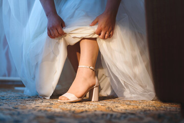 foot of bride in wedding shoe