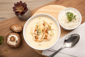 Creamy chicken mushroom soup, easy chicken soup recipe with optional cream of mushroom soup and herbs in a white bowl.