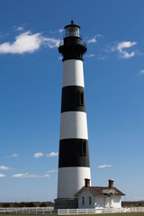 Bodie Island Lighthouse near Nags Head, NC in the Outer Banks of North Carolina with beautiful blue...