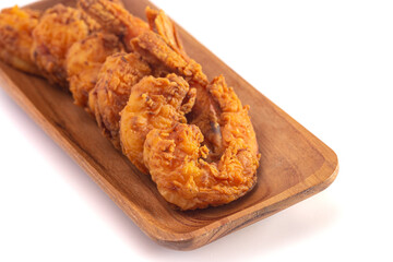 Breaded and Fried Jumbo Shrimp with Tails on a White Background