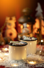 Hot chocolates surrounded with christmas decorations