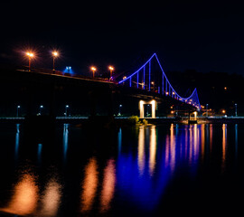 Fototapeta na wymiar bridge over river at night, Kyiv, Ukraine