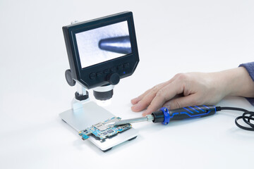 Digital microscope for repair of electronic components.