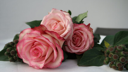 closeup of abouquet of roses with sunny reflections