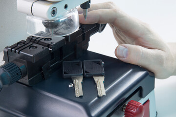 Fototapeta na wymiar Production of home keys on a specialized vertical key machine.