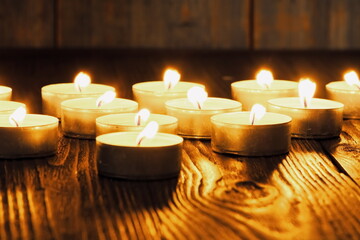 Many burning candles with shallow depth of field