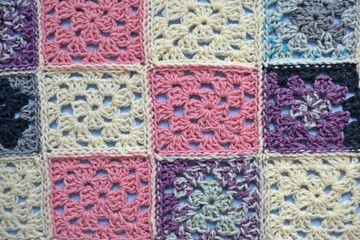 Multi-colored knitted background.An abstract geometric pattern.