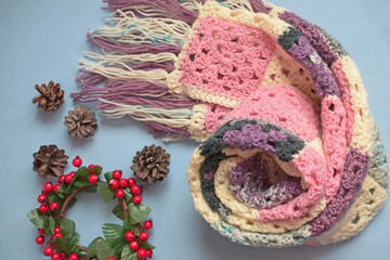 Multi-colored scarf, crocheted.Knitting in the patchwork style.