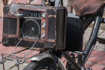 Vintage radio mounted on old fashioned three wheel bike