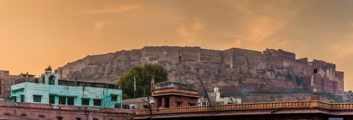 Fototapeta premium A view at sunset from Jodhpur, Rajasthan, India looking towards the fortress above the city