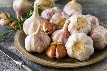 Healthy food. Garlic Cloves and Bulb close-up on a stone or slate table.