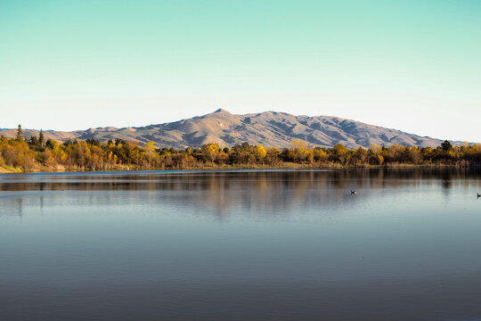 Hilly Landscape Reflection on Lake In Autumn