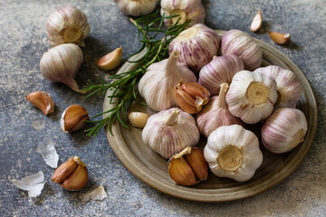 Healthy food. Garlic Cloves and Bulb on a stone or slate table.