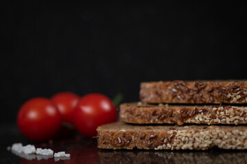 Slices of healthy diet bread and fresh cherry tomatoes