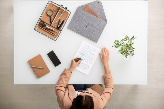 Young Elegant Businesswoman Underlining Main Points And Terms Of Contract