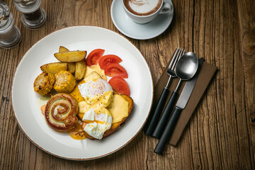 English breakfast, toast, poached egg, sauce, sausage
