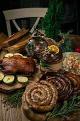 Delicious Roast Christmas duck with apples, homemade sausage, salad and Christmas cake

