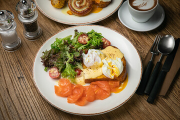English breakfast, toast, poached egg, sauce, salmon
