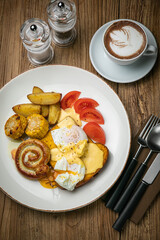English breakfast, toast, poached egg, sauce, sausage
