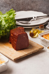 Meat and sausage delicacies. Cold cut. Sausage, bacon, carpaccio, knuckle.