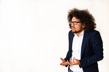 Latin American model in a suit, puzzled expression, white background 