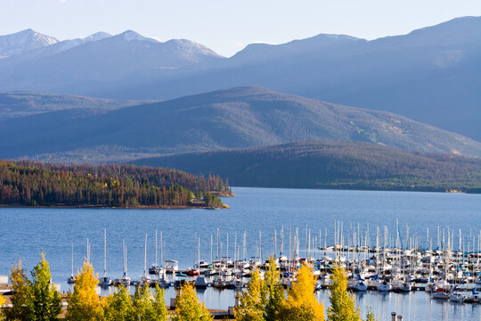 Dillon Marina Autumn - Sail boats docked at Dillon Marina on Dillon Reservoir in Autumn with Arapahoe National Forest in background, Summit County, Colorado
